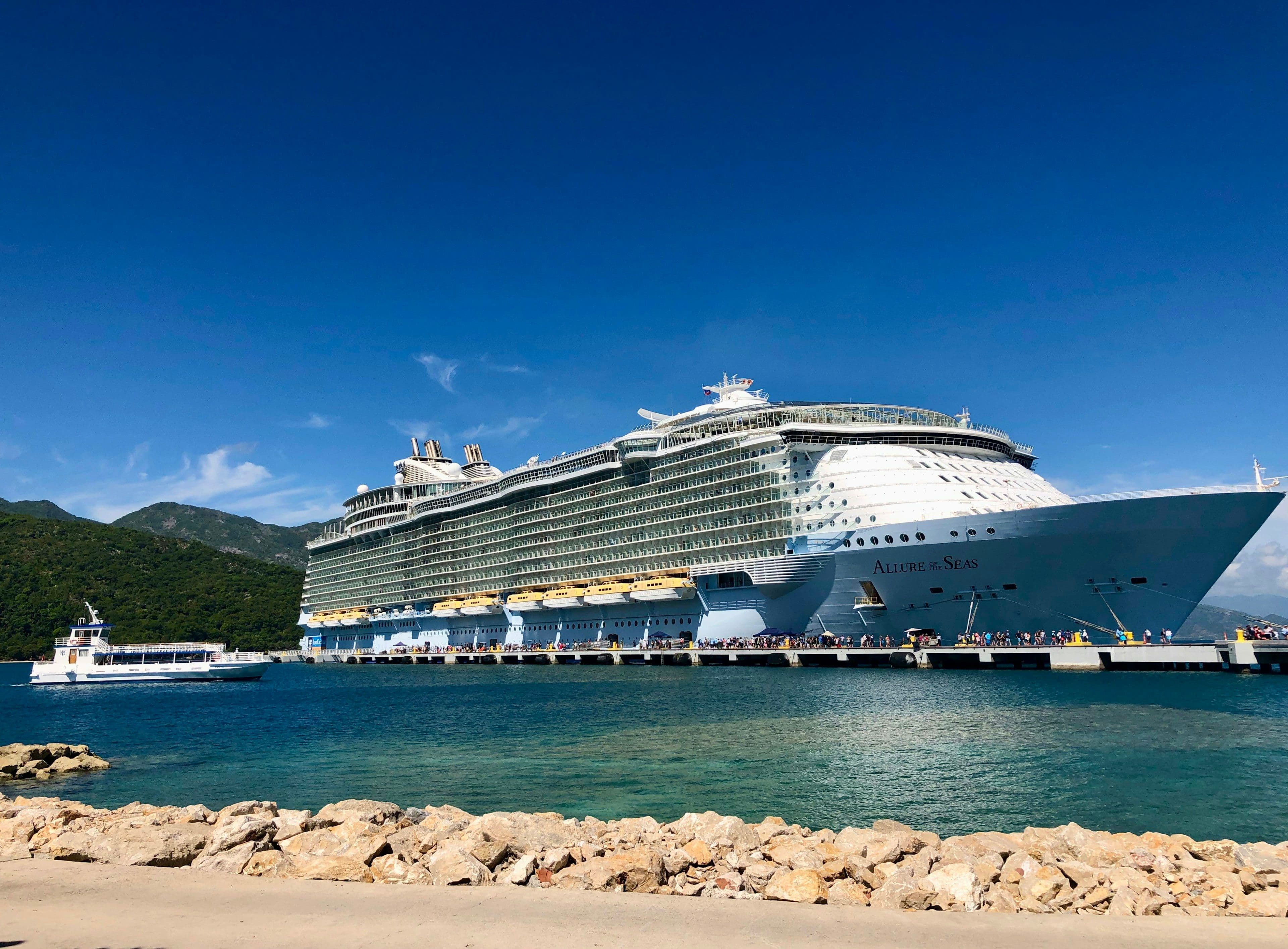 Passengers boarding a Royal Caribbean ship at the pier
